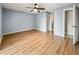 Spacious bedroom with light gray walls and wood-look floors at 10454 Ventura Dr, Spring Hill, FL 34608