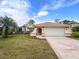 Single-story house with a two-car garage and manicured lawn at 10454 Ventura Dr, Spring Hill, FL 34608