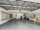 Attached garage with ample storage space and workbench at 10454 Ventura Dr, Spring Hill, FL 34608