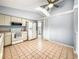 Efficient kitchen with light cabinetry and tiled floors at 10454 Ventura Dr, Spring Hill, FL 34608