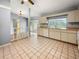 Open kitchen with light wood cabinets and tile floor at 10454 Ventura Dr, Spring Hill, FL 34608