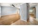 Bright living room featuring light gray walls and wood-look floors at 10454 Ventura Dr, Spring Hill, FL 34608