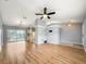 Spacious living area with light gray walls and wood-look floors at 10454 Ventura Dr, Spring Hill, FL 34608