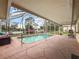 Inviting screened pool area with spacious patio at 10454 Ventura Dr, Spring Hill, FL 34608