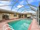 Large screened pool with plenty of space for lounging at 10454 Ventura Dr, Spring Hill, FL 34608