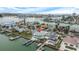 Aerial view of a house with pool, dock, and canal views at 11185 5Th E St, Treasure Island, FL 33706