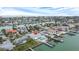 Aerial view of single story home with pool and canal access at 11185 5Th E St, Treasure Island, FL 33706