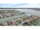Wide aerial view showing home's waterfront location and neighborhood at 11185 5Th E St, Treasure Island, FL 33706