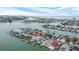 Aerial view of waterfront home with private dock and pool at 11185 5Th E St, Treasure Island, FL 33706