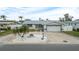 Front view of house showcasing the landscaping and garage at 11185 5Th E St, Treasure Island, FL 33706