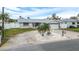 Front view of house showcasing landscaping and driveway at 11185 5Th E St, Treasure Island, FL 33706