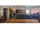Bright living room featuring a large TV and comfortable seating at 11185 5Th E St, Treasure Island, FL 33706