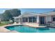 Relaxing pool area with patio furniture and canal views at 11185 5Th E St, Treasure Island, FL 33706