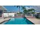 Spacious pool with surrounding patio and canal views at 11185 5Th E St, Treasure Island, FL 33706