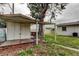 White shed with wooden deck and covered porch at 11301 59Th Ter, Seminole, FL 33772