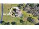 Directly above view of house, pool and driveway at 11518 Hammock Oaks Ct, Lithia, FL 33547