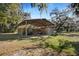 Rustic barn with storage shed and fenced area, ideal for animals or equipment at 11518 Hammock Oaks Ct, Lithia, FL 33547