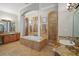 Elegant bathroom with soaking tub, walk-in shower, and granite finishes at 11518 Hammock Oaks Ct, Lithia, FL 33547