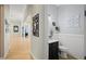 Powder room with dark vanity, toilet, and decorative wall art at 11518 Hammock Oaks Ct, Lithia, FL 33547