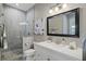 Spa-like bathroom with a large walk-in shower, toilet, and modern vanity at 11518 Hammock Oaks Ct, Lithia, FL 33547