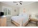 Spacious bedroom with a king-size bed and plenty of natural light at 11518 Hammock Oaks Ct, Lithia, FL 33547
