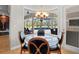 Breakfast nook with glass table and chairs, overlooking the pool at 11518 Hammock Oaks Ct, Lithia, FL 33547