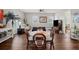 Casual dining area with round table, wicker chairs, and hardwood floors at 11518 Hammock Oaks Ct, Lithia, FL 33547