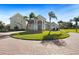 Large home with circular driveway and palm trees at 11518 Hammock Oaks Ct, Lithia, FL 33547
