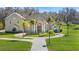 Two-story home with circular driveway and lush landscaping at 11518 Hammock Oaks Ct, Lithia, FL 33547