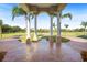Covered porch with columns and views of the property at 11518 Hammock Oaks Ct, Lithia, FL 33547
