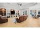 Open concept Gathering room with views into the kitchen area at 11518 Hammock Oaks Ct, Lithia, FL 33547