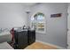 Laundry room with washer, dryer, utility sink, and window at 11518 Hammock Oaks Ct, Lithia, FL 33547