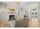 Spacious living room with fireplace and access to the foyer at 11518 Hammock Oaks Ct, Lithia, FL 33547