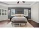 Spacious main bedroom with dark-gray accent wall and hardwood floors at 11518 Hammock Oaks Ct, Lithia, FL 33547
