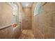 Large walk-in shower with tile surround and built-in shelving at 11518 Hammock Oaks Ct, Lithia, FL 33547