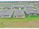 Aerial view of houses and a lake at 13028 Homestead Ln, Parrish, FL 34219