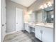 Double vanity bathroom with modern fixtures and ample counter space at 13028 Homestead Ln, Parrish, FL 34219