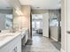 Double vanity bathroom with a large walk-in shower at 13028 Homestead Ln, Parrish, FL 34219