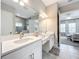 Elegant bathroom with double sinks and modern lighting at 13028 Homestead Ln, Parrish, FL 34219