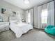 Bright bedroom with a queen-size bed and calming decor at 13028 Homestead Ln, Parrish, FL 34219