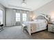 Bright Primary bedroom featuring a king-size bed and ample natural light at 13028 Homestead Ln, Parrish, FL 34219
