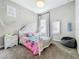 Charming bedroom with a white bed frame and mermaid-themed bedding at 13028 Homestead Ln, Parrish, FL 34219