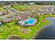 Aerial view of community pool and lake at 13028 Homestead Ln, Parrish, FL 34219