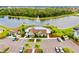 Community pool with lounge chairs and a clubhouse at 13028 Homestead Ln, Parrish, FL 34219