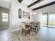 Bright dining room featuring a rustic wooden table at 13028 Homestead Ln, Parrish, FL 34219