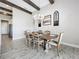 Rustic-chic dining area with wood table and chandelier at 13028 Homestead Ln, Parrish, FL 34219