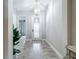 Bright entryway with tile flooring and a decorative chandelier at 13028 Homestead Ln, Parrish, FL 34219