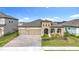 Two-story house with a two-car garage and well-manicured lawn at 13028 Homestead Ln, Parrish, FL 34219