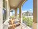 Covered porch with rocking chairs, offering a relaxing outdoor space at 13028 Homestead Ln, Parrish, FL 34219