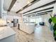 Open concept kitchen with hardwood floors and exposed beams at 13028 Homestead Ln, Parrish, FL 34219